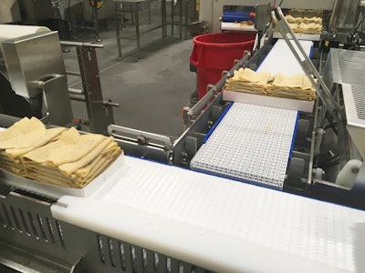 After being placed in trays robotically, tacos are overwrapped and then head to a spiral freezer for 4 to 4.5 hr.