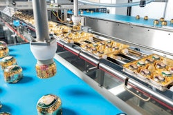 Products feed into the Schubert system via lateral belts.