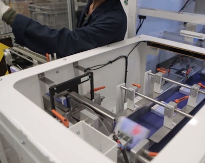 Cartons are properly oriented before stacking.