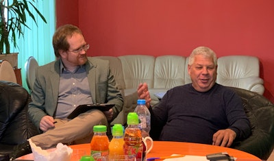 With the help of an interpreter, Waldemar Podniesiński (right), Mokobody’s president, explains the challenges that beef producers face in Poland.