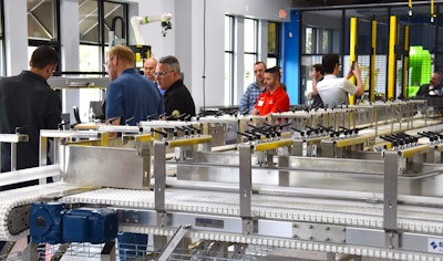 ROBEX sales engineers demonstrate an automated assembly line to prospects.