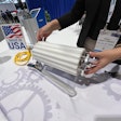 Sonia Kanaris demonstrates the easy removal of a profiled, nylon continuous sleeve on this drum motor at PACK EXPO International.
