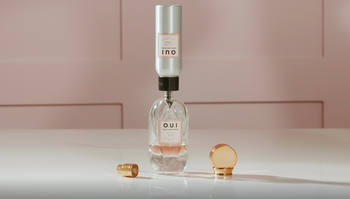 A clever dispensing applicator on the aluminum bottle refills for O.U.i.&rsquo;s eaux de parfum product ensures product is transferred to the reusable glass package cleanly and easily, without product waste.