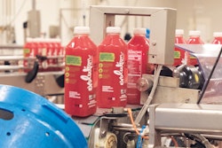 At the loading and tilting station, bottled juices are loaded automatically into vessels.