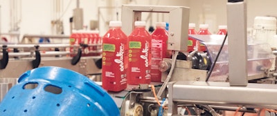 At the loading and tilting station, bottled juices are loaded automatically into vessels.