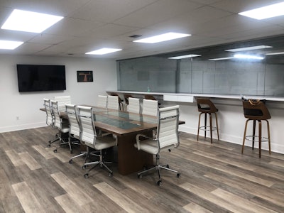 Garrido Printing Equipment skybox is a conference room and workspace overlooking the training center.