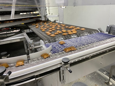 The product delivery system that takes pies from the spiral cooler to packaging ensures minimal product damage.