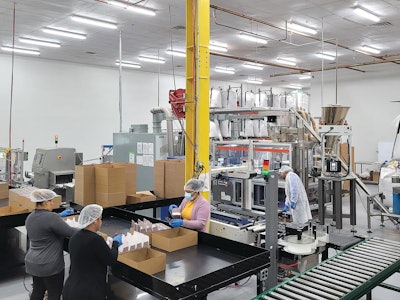 Workers at the JJM Packaging company on the production line at the Totowa, NJ facility.