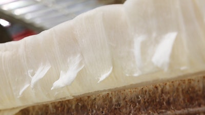 At the Swersey Silos facility, mycelium is grown atop a woodchip slurry in 100 x 3 ft beds.