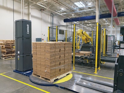 Interlocking pallets are built in an articulated robot arm palletizer, then are forklifted to an adjacent turntable-style pallet stretch wrapper. Stretch wrapping is
