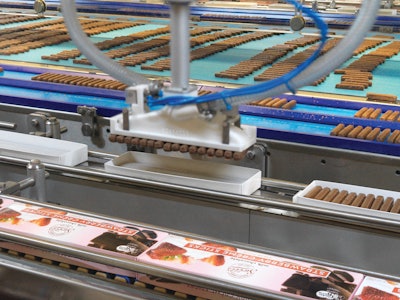 Whole layers of 16- or 17-ct product are cartoned by SCARA robots with vacuum grippers. The filled cartons are sold by weight, not count, and product weight can be variable by batch. So the system allows for on-the-fly changes from 16- to 17-ct to get a close as possible to the 10.5-oz target weight without going under, limiting giveaway of expensive chocolate.