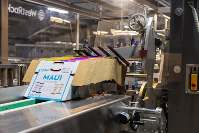 Carton blanks are stacked at the ready in the WestRock cartoner for mix packs of beer.