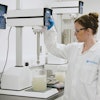 Modern tabletop processing equipment gives R&D teams unprecedented control over formulations before scaling up. Here, a food technician creates a small batch of guar gum.