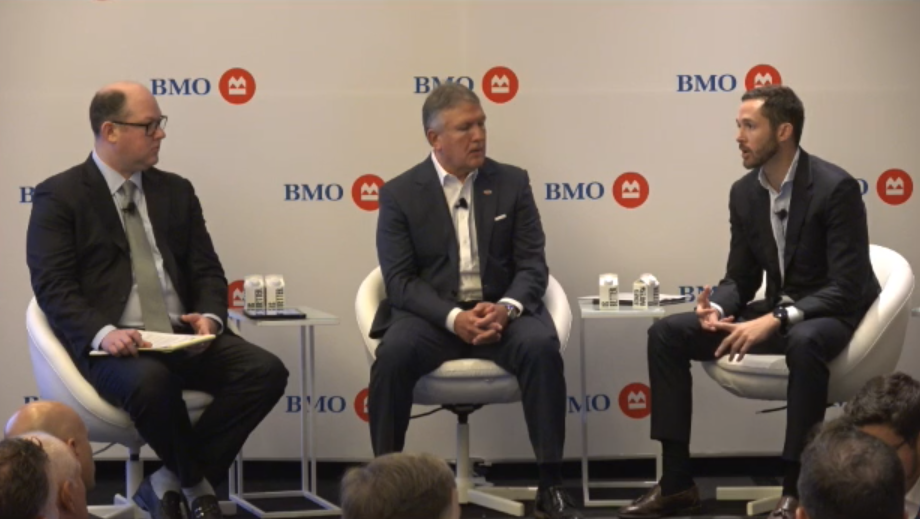 Tyson&rsquo;s John R. Tyson (right) and Donnie King (center) chat with analyst Andrew Strelzik at the BMO Global Farm to Market Conference.