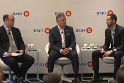 Tyson’s John R. Tyson (right) and Donnie King (center) chat with analyst Andrew Strelzik at the BMO Global Farm to Market Conference.