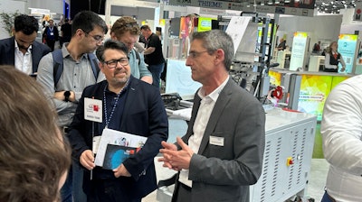 Melichar (left) and Gerardo Gonzalez (right) describe the REA JET late-stage customization solution.