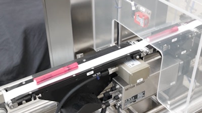 Fully assembled mascara tubes are checkweighed immediately upon exiting the filling block.