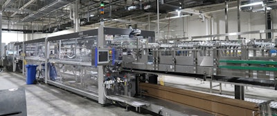 This tray packer/shrink wrapper unitizes cartons in corrugated trays.