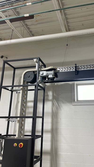 Once in the packaging hall, cans are lowerated from mezzanine level to floor height.