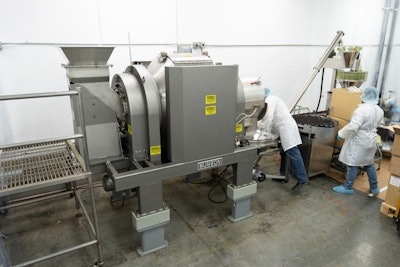 The Rotary Batch Mixer discharges to a screw conveyer, which transfers mixed powder products to an auger filling machine.