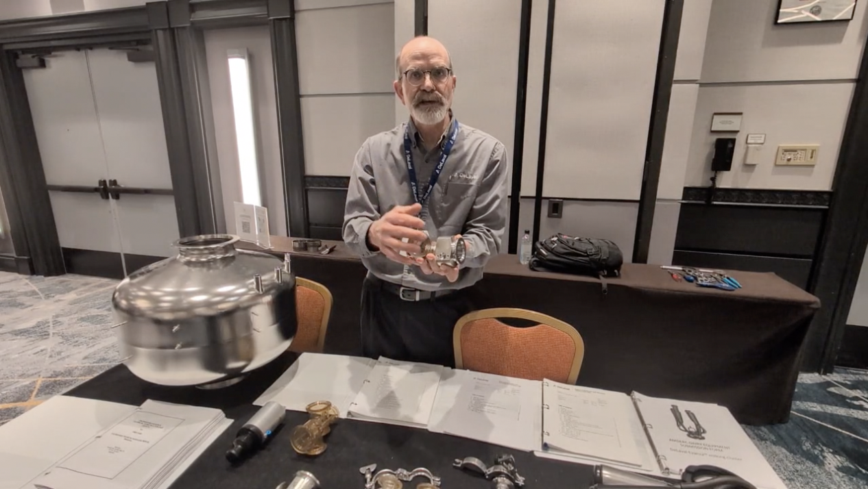 Chris Horton, AMS Systems Specialist for DeLaval, explains dairy equipment used for cow-milking processes.