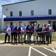 Homestyle Direct CEO Jeff Barteau (holding scissors) and State Senator Joey Hensley (right of Barteau) are joined by the Homestyle Direct team cutting the ribbon at the company's new fulfillment center in Lewisburg, Tenn.