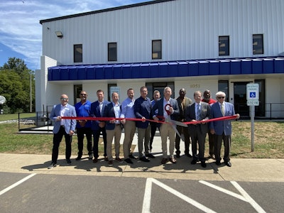 Homestyle Direct CEO Jeff Barteau (holding scissors) and State Senator Joey Hensley (right of Barteau) are joined by the Homestyle Direct team cutting the ribbon at the company's new fulfillment center in Lewisburg, Tenn.