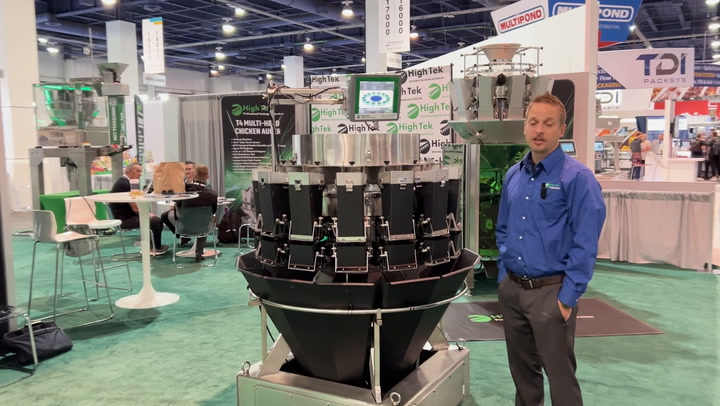 Multihead weighing machine at industrial trade show with technical display