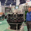 Multihead weighing machine at industrial trade show with technical display