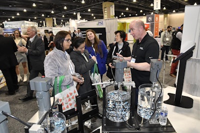 Attendees and exhibitors interact at PACK EXPO East 2024.