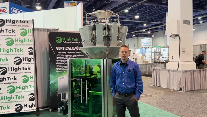 High Tek vertical packaging machine at industrial trade show with equipment display