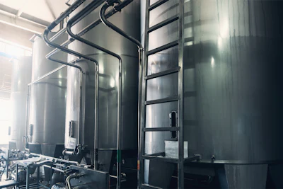 The February equipment explosion may have been caused by a malfunctioning pressure relief valve on a tank for boiling broth, the Janesville Police department says.
