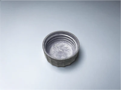 Advanced fiber cap sample approaching plastic-like performance and feel.