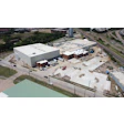 Site constraints include active rail lines that made construction challenging and define the site's footprint.