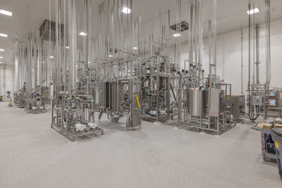 A full walk-on interstitial ceiling at California Dairies, Inc.’s Valley Natural Beverages plant in Bakersfield, Calif., houses piping, wiring, and utilities, giving maintenance personnel easy access while keeping production floors clear. Use of an interstitial space also prevents horizontal piping runs that can collect moisture during washdowns and potentially house bacteria.