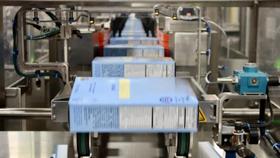 Dry flaked product from a large food brand moves through a horizontal cartoner at GreenSeed.