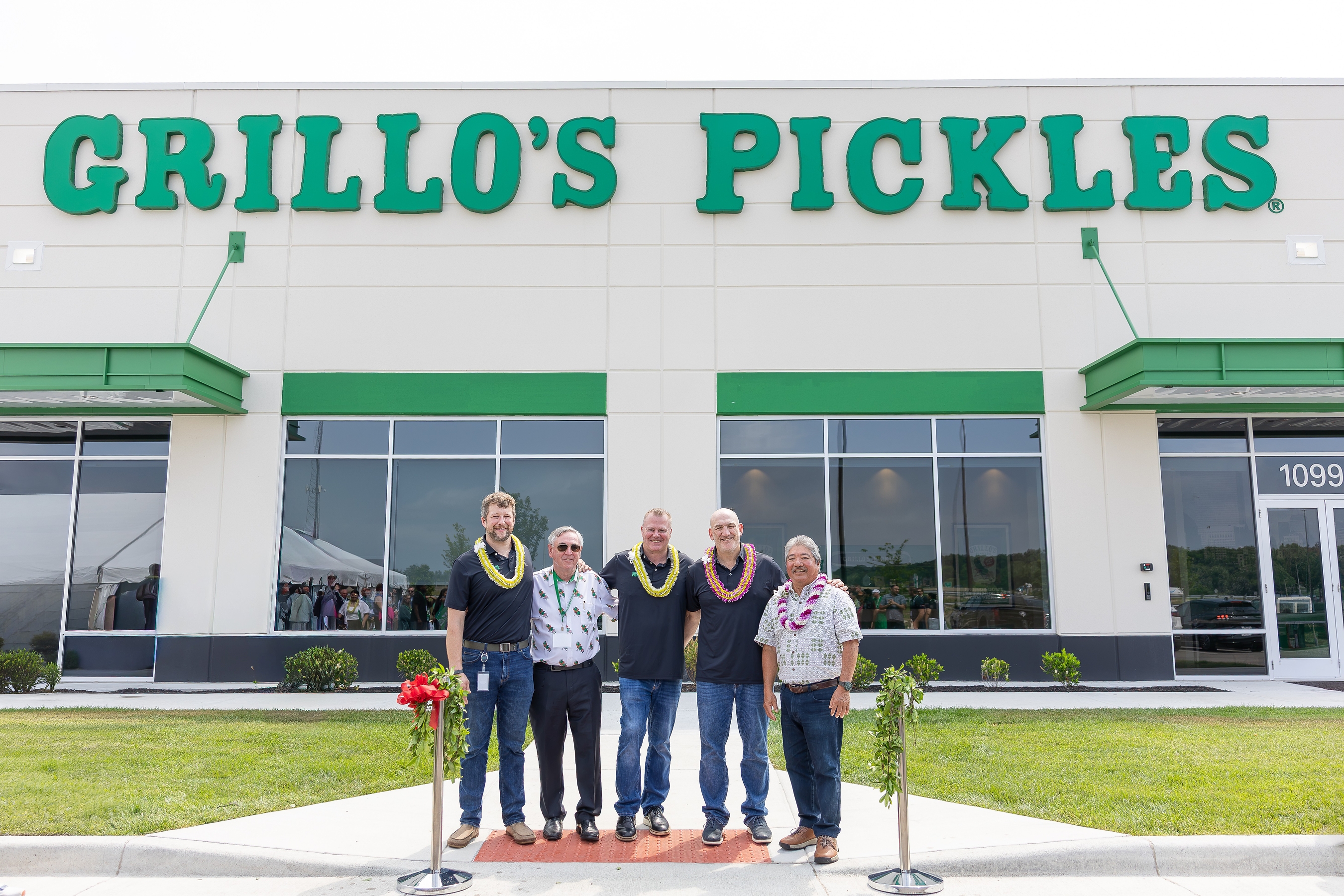 From left, Dustin Etchison (Grillo's Pickles Indiana General Manager), John Linehan (IFG President & Board Director), Bill Russell (Grillo's Pickles Chief Operating Officer), Adam Kaufman (Grillo's Pickles President & CEO) and Mark Taira (King's Hawaiian CEO) celebrate the grand opening of the new Grillo's Pickles production facility in Bartholomew County, Ind.