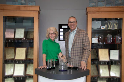 Martha Brooke, Interaction Metrics Founder, presents Dennis Fitzgerald, Yaskawa America VP of Customer Satisfaction, with the 2025 Outstanding CX Award.