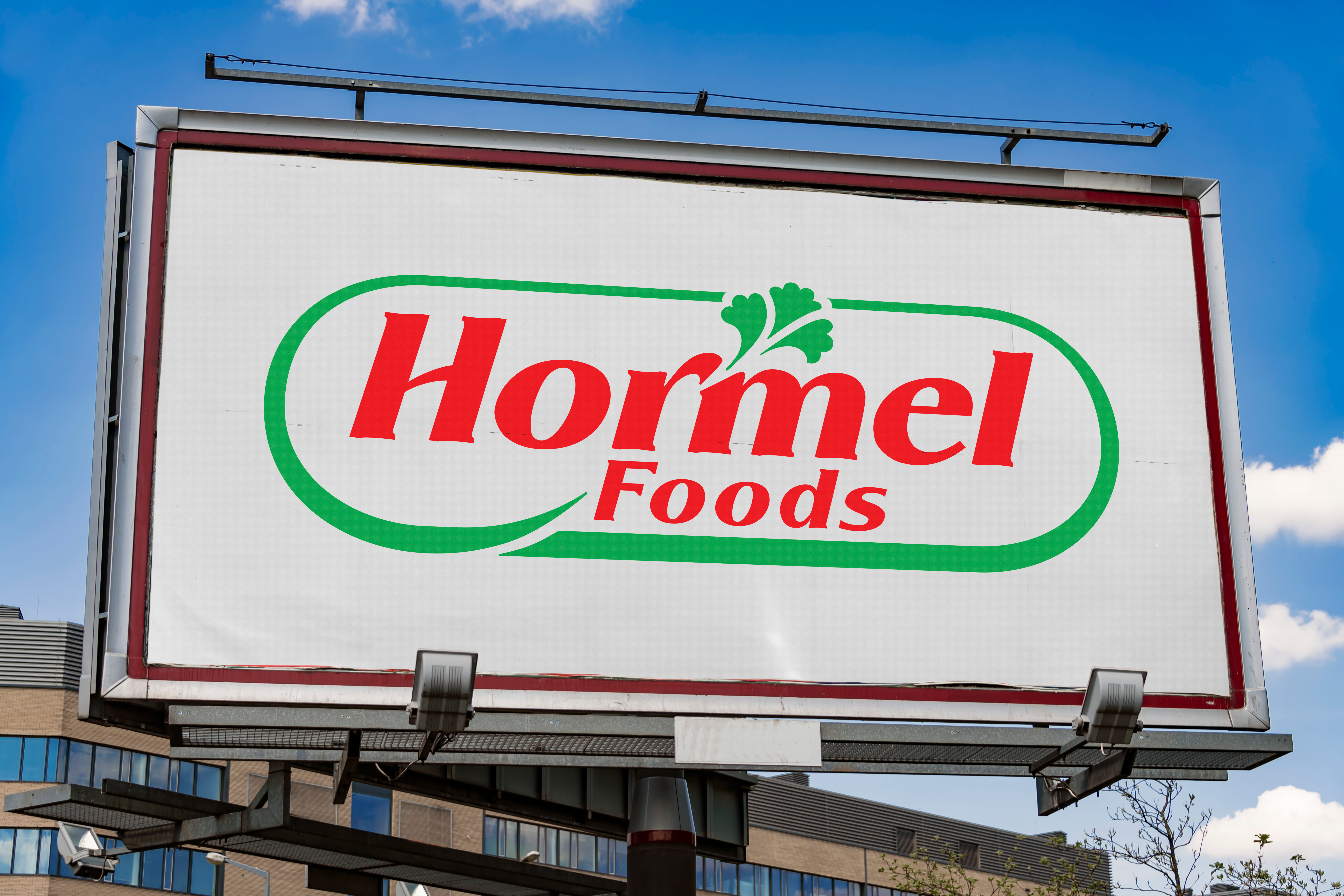 Hormel Foods logo on outdoor billboard advertisement against blue sky
