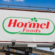 Hormel Foods logo on outdoor billboard advertisement against blue sky
