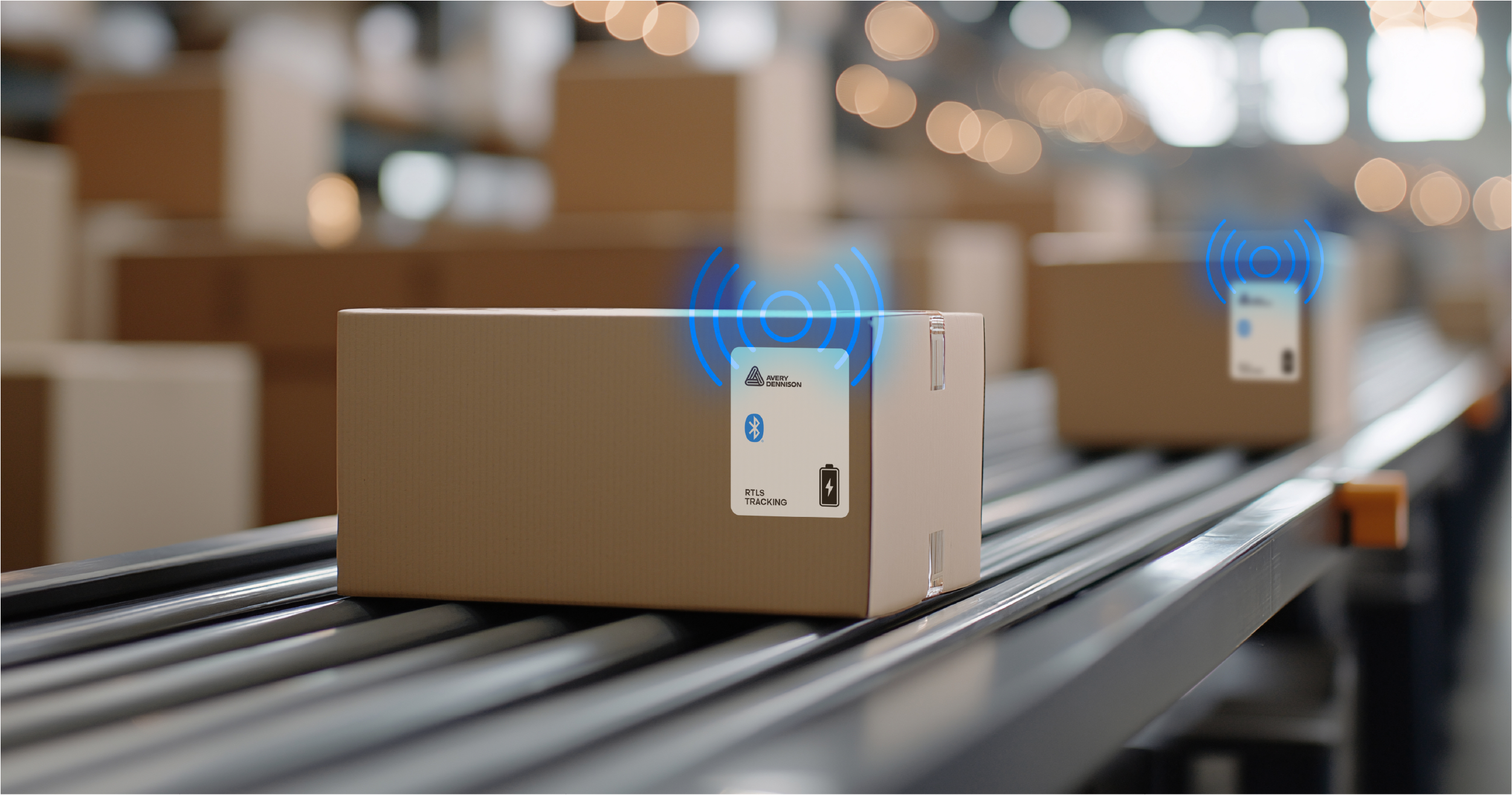 Cardboard box with Bluetooth tracking device on conveyor belt in warehouse with bokeh lighting