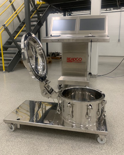 READCO industrial mixing machine with stainless steel drum and control panel in warehouse facility