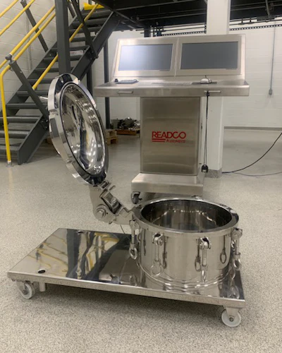 READCO industrial mixing machine with stainless steel drum and control panel in warehouse facility