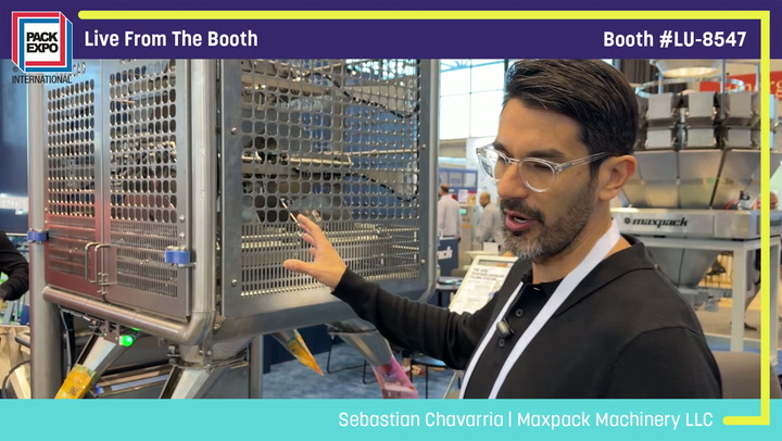 Man presenting industrial packaging machinery at Pack Expo booth LU-8547
