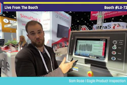 Man demonstrating Eagle Product Inspection equipment at Pack Expo booth LU-7303