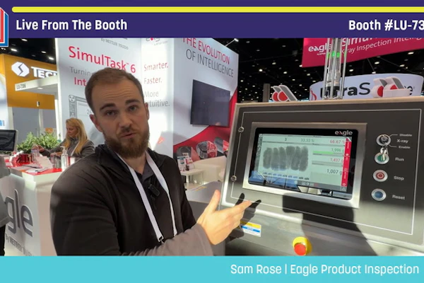 Man demonstrating Eagle Product Inspection equipment at Pack Expo booth LU-7303