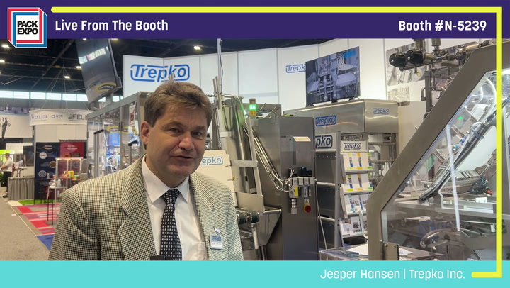 Professional man in beige blazer at Trepko Inc. trade show booth N-5239 with industrial equipment and branding displays