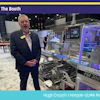 Professional demonstrating FM 300 packaging machinery at Pack Expo booth S-2939
