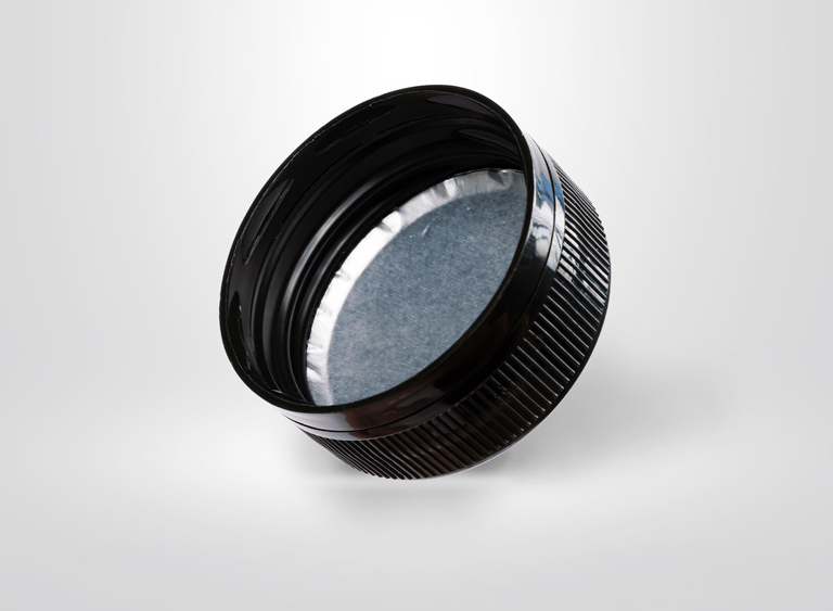 Black camera lens with textured grip ring and blue-tinted glass element on white background