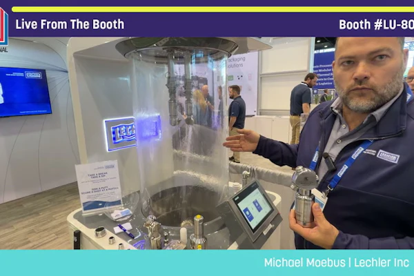 Michael Moebus from Lechler Inc demonstrates packaging equipment at Pack Expo booth LU-8043